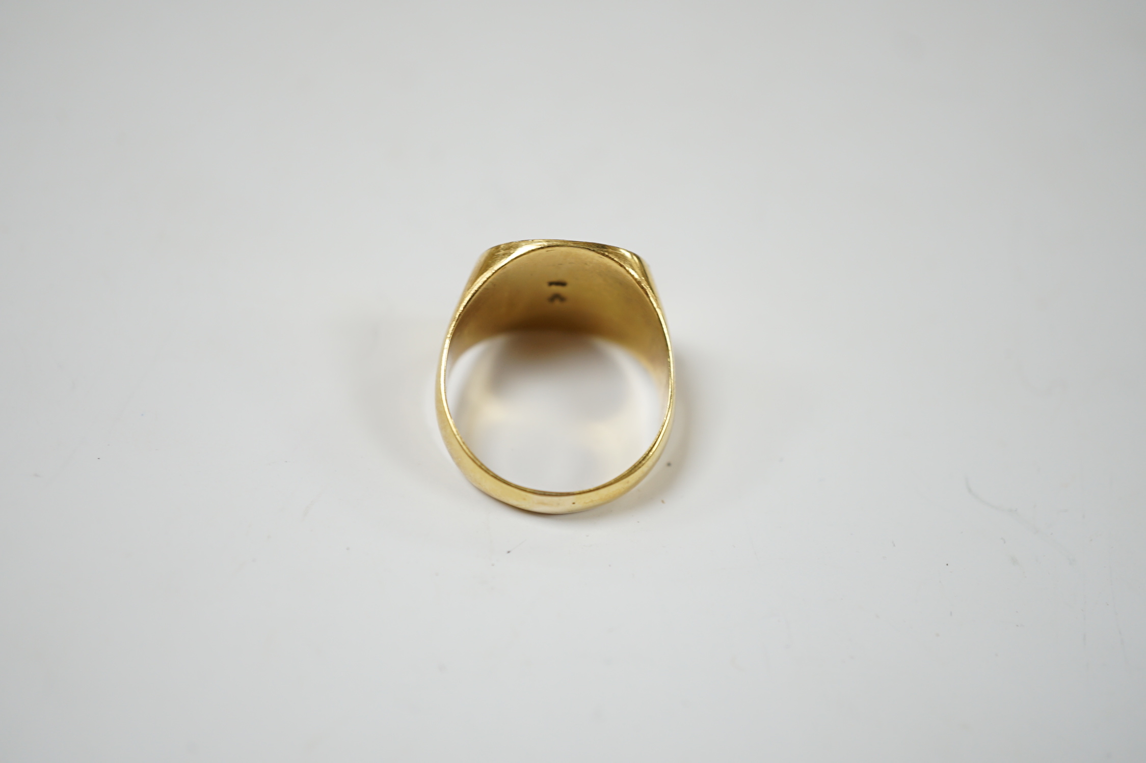 A 750 yellow metal signet ring, size N